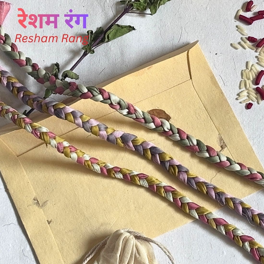 Silk Thread Rakhi handcrafted from naturally dyed silk strips. Includes cotton potli, Tilak, Akshat and a handmade recycled cotton rag envelope.