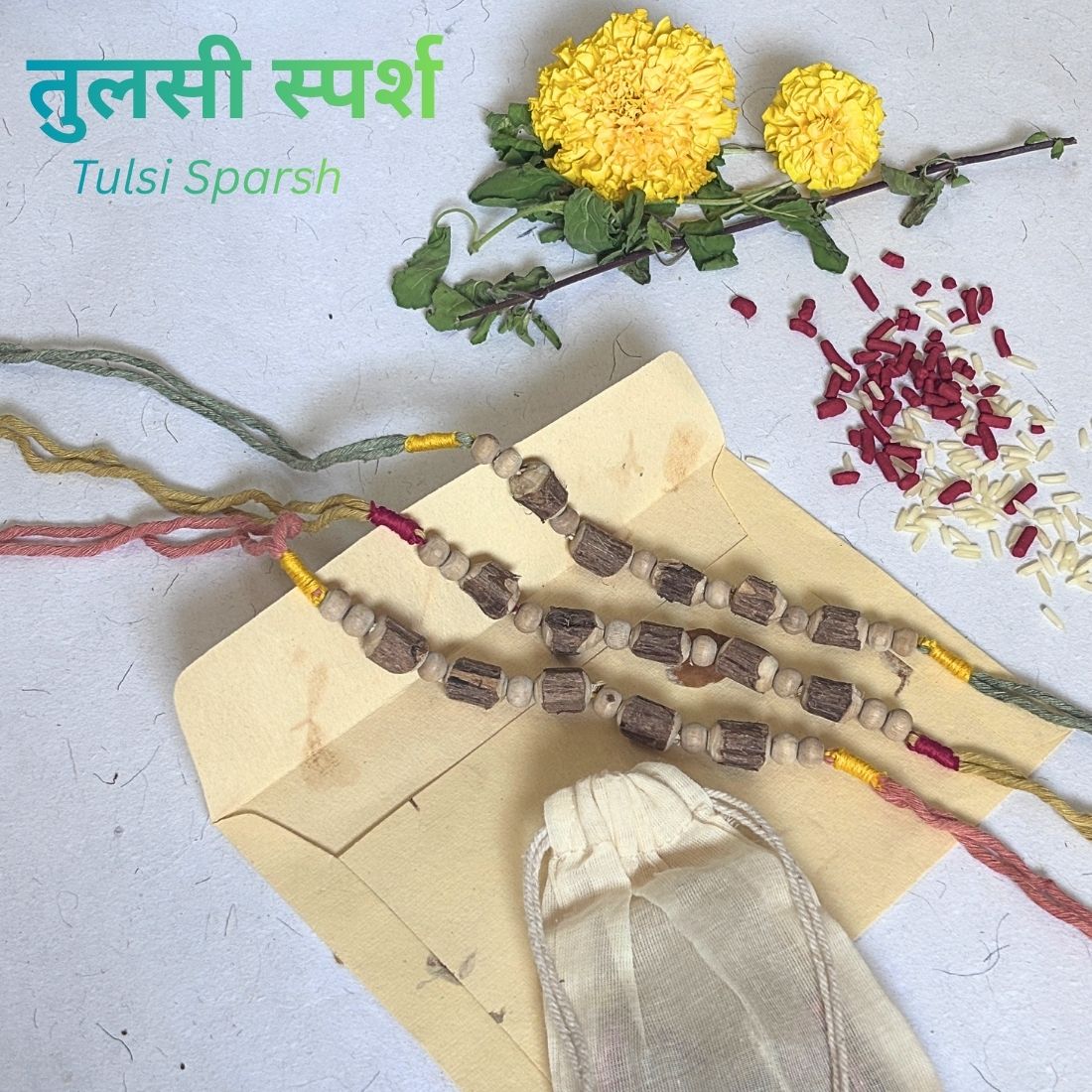 Tulsi Rakhi handcrafted with naturally dyed organic cotton threads and sacred Tulsi beads. Includes cotton potli, Tilak, Akshat and a handmade recycled cotton rag envelope.