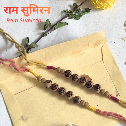 Eco Friendly Rakhi handcrafted with naturally dyed organic cotton threads and laser engraved Tulsi beads. Includes cotton potli, Chandan Tilak, Akshat and handmade recycled cotton rag envelope.