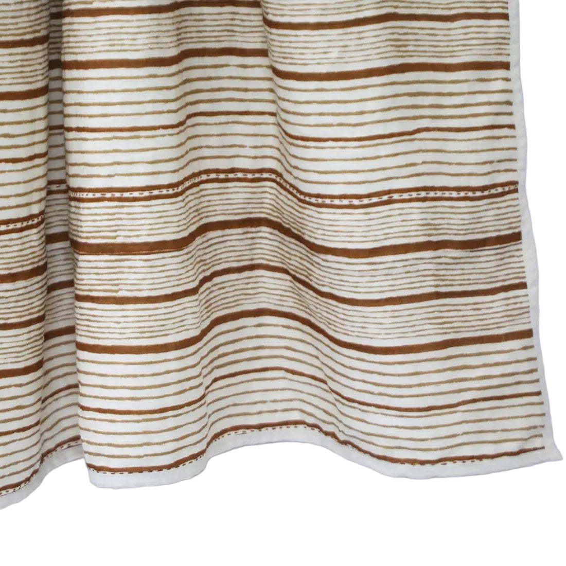 Warm, earthy, and exquisitely crafted, this Brown Striped Linen Throw is a beautiful fusion of natural materials and traditional Indian Kantha embroidery. Constructed with three layers of carefully chosen fabric, it offers both sumptuous comfort and enduring elegance. Top Layer: Soft linen in a rich spectrum of brown stripes Middle and Bottom Layers: Breathable cotton for warmth and texture Embroidery: Traditional Kantha stitch by skilled women artisans Size: 50 x 70 inches Colour: Earthy brown tones 