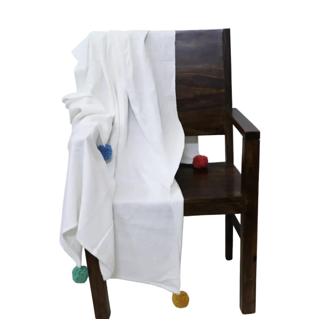 Pure, playful, and wonderfully soft, this White Handloom Cotton Throw Blanket is handwoven from 100% hand-spun cotton yarn and finished with cheerful multicolour Pom Poms at all four corners — a delightful detail that adds personality and charm to any space. Fabric: 100% Handwoven Cotton (hand-spun yarn) Size: 46 x 78 inches (117 x 198 cm) Colour: White with multicolour Pom Pom corners Light, soft, and cosy all at once — this perfectly weighted throw works beautifully year-round. Drape it over your sofa, 