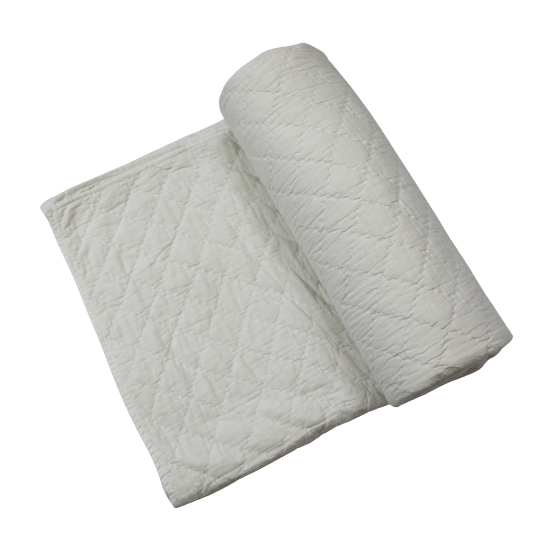 classic white kantha quilt styled on bed
