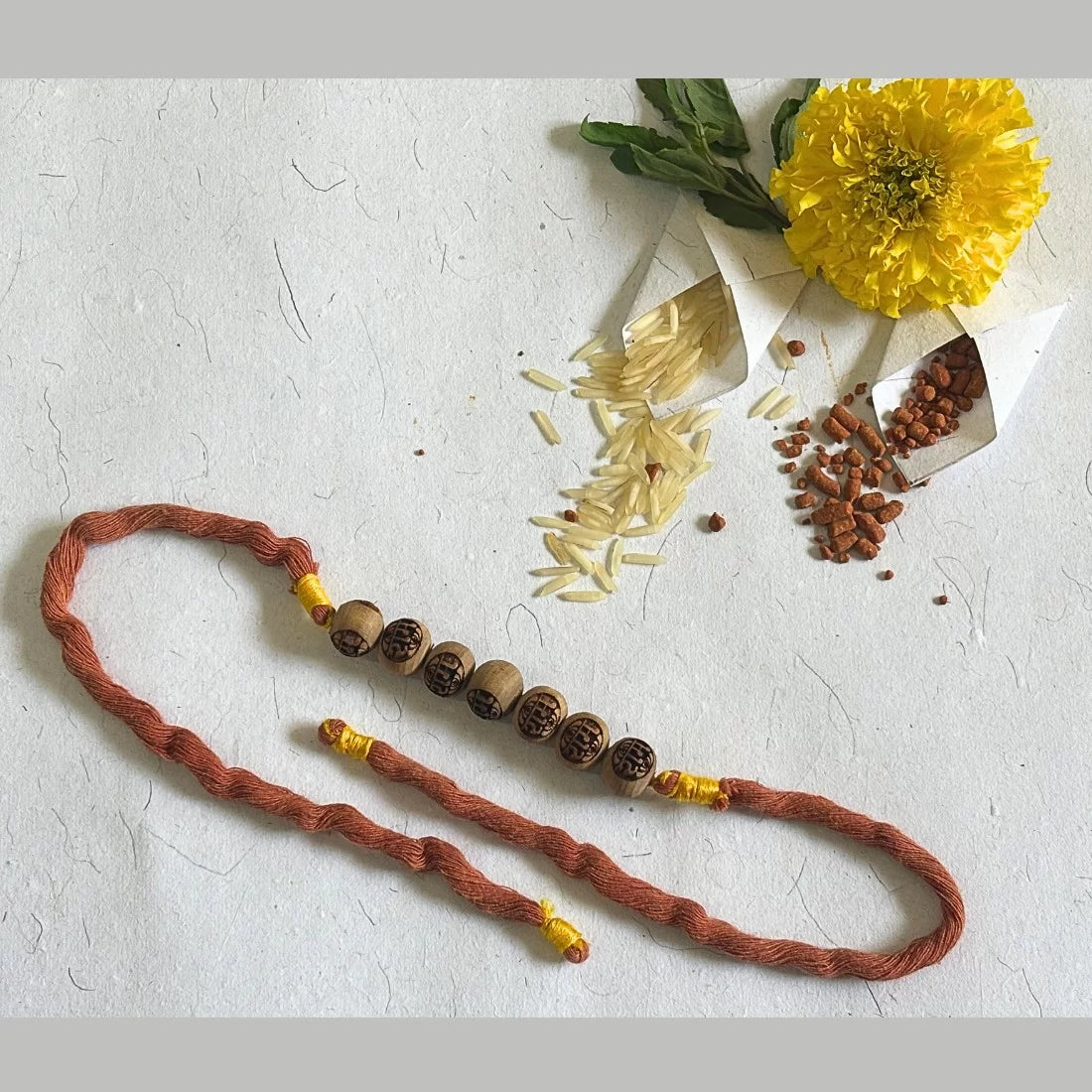 Tulsi Bead Rakhi - Ram Carved | Natural Dyed Organic Cotton | Eco-Friendly