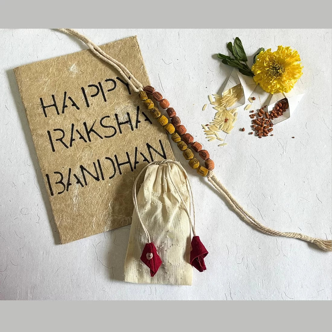 Tulsi bead rakhi madder red turmeric yellow natural dyed eco friendly handmade rakshabandhan