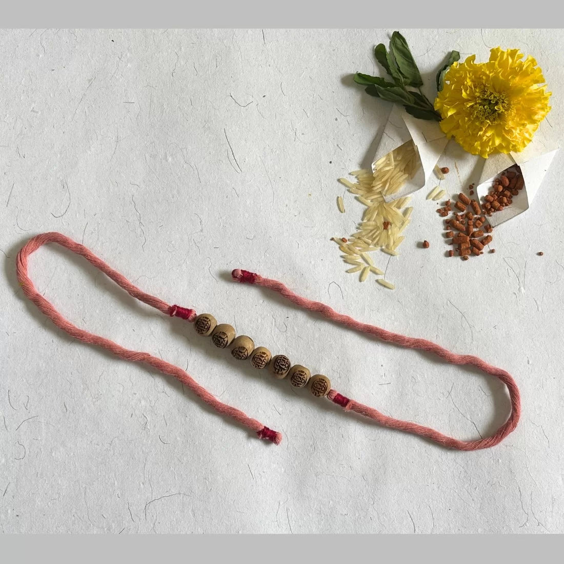 Radha Carved Tulsi Bead Rakhi - Natural Dyed Organic Cotton | Eco-Friendly