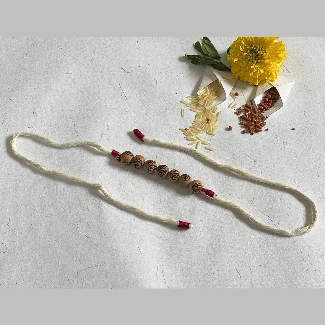 Radha Carved Tulsi Bead Rakhi - Natural Dyed Organic Cotton | Eco-Friendly