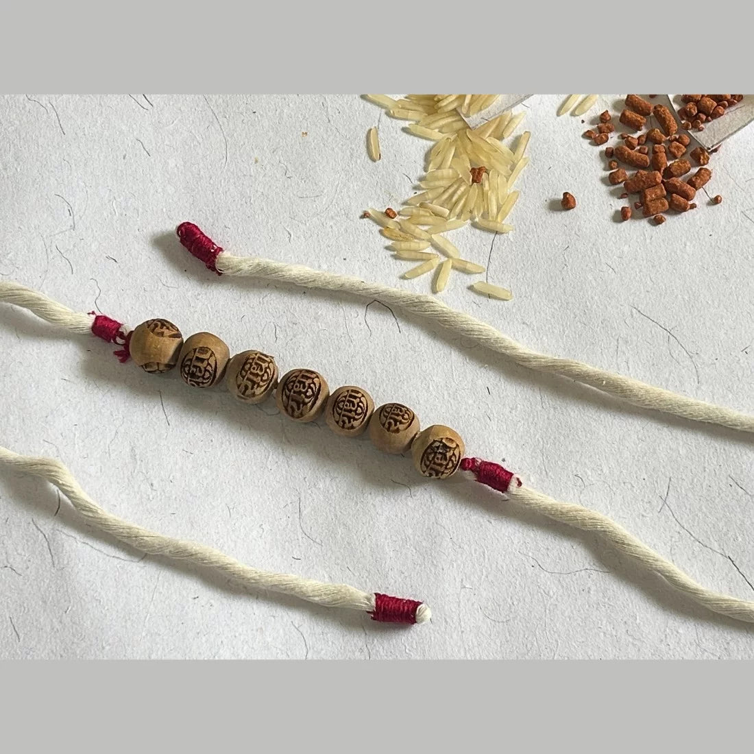 Radha Carved Tulsi Bead Rakhi - Natural Dyed Organic Cotton | Eco-Friendly