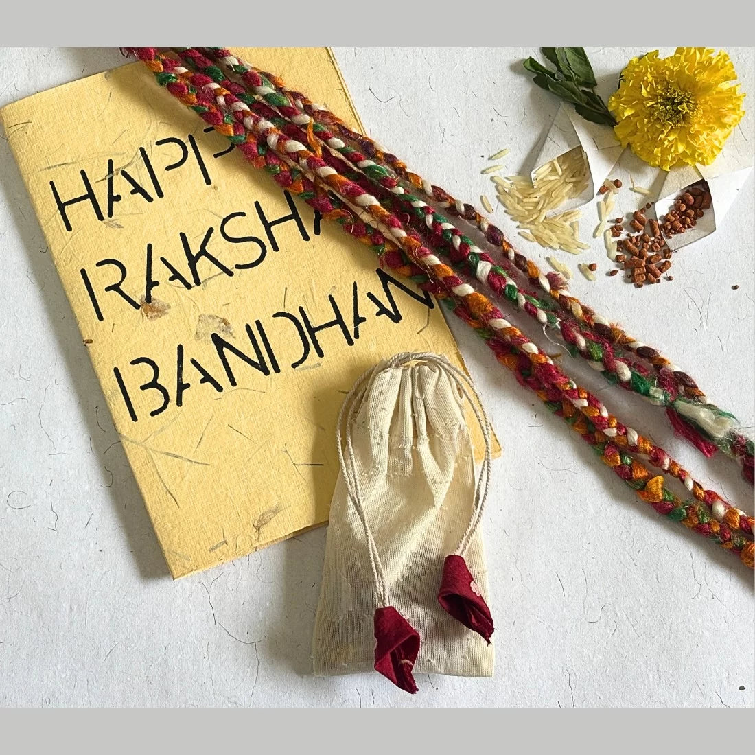 Eco-friendly rakhi threads made from waste silk. Set of 5 in vibrant colours. 15-17 inches. Comes in cotton potli with recycled card. Handmade in India.