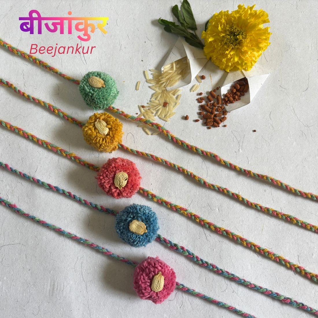 Seed Rakhi handcrafted from recycled cotton threads and pom-poms with assorted seeds. Includes cotton potli, Tilak, Akshat and handmade recycled cotton rag envelope.