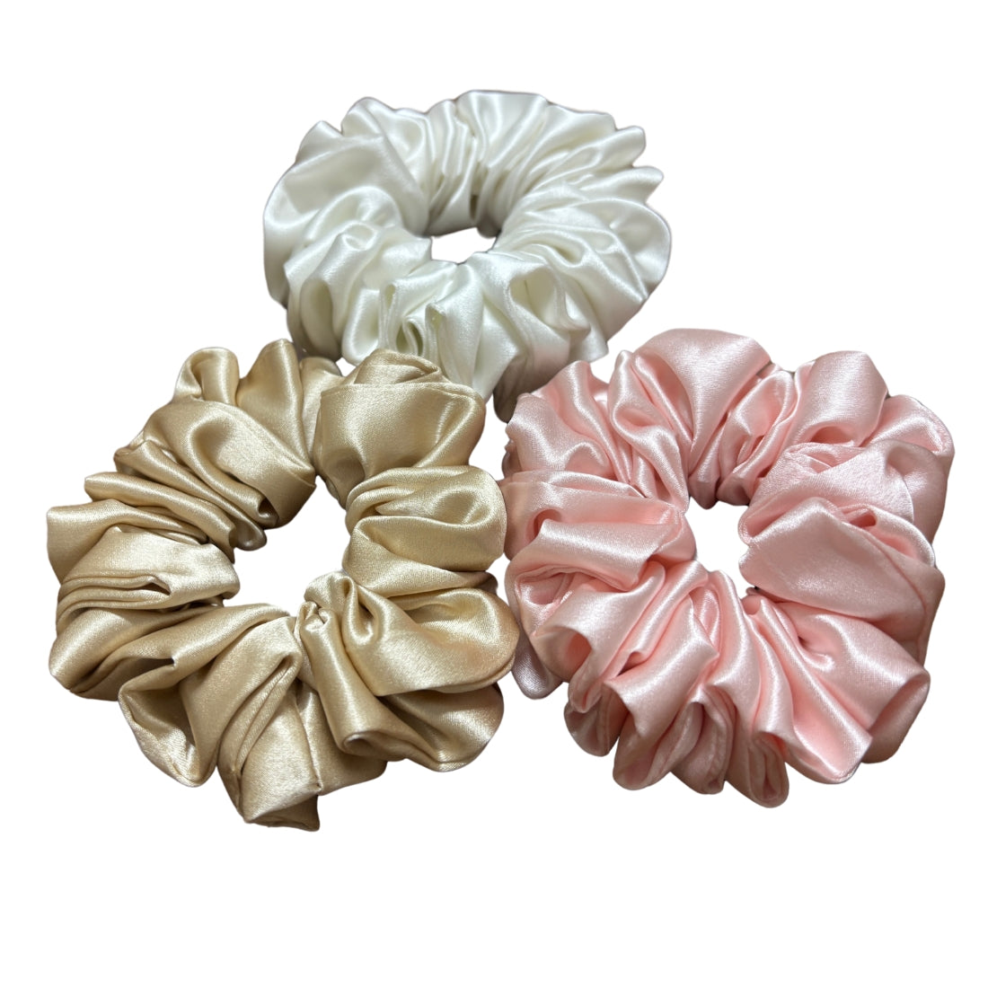 Elevate your hair care routine with our Pure Silk Scrunchies, crafted from 100% 22 momme silk fabric.