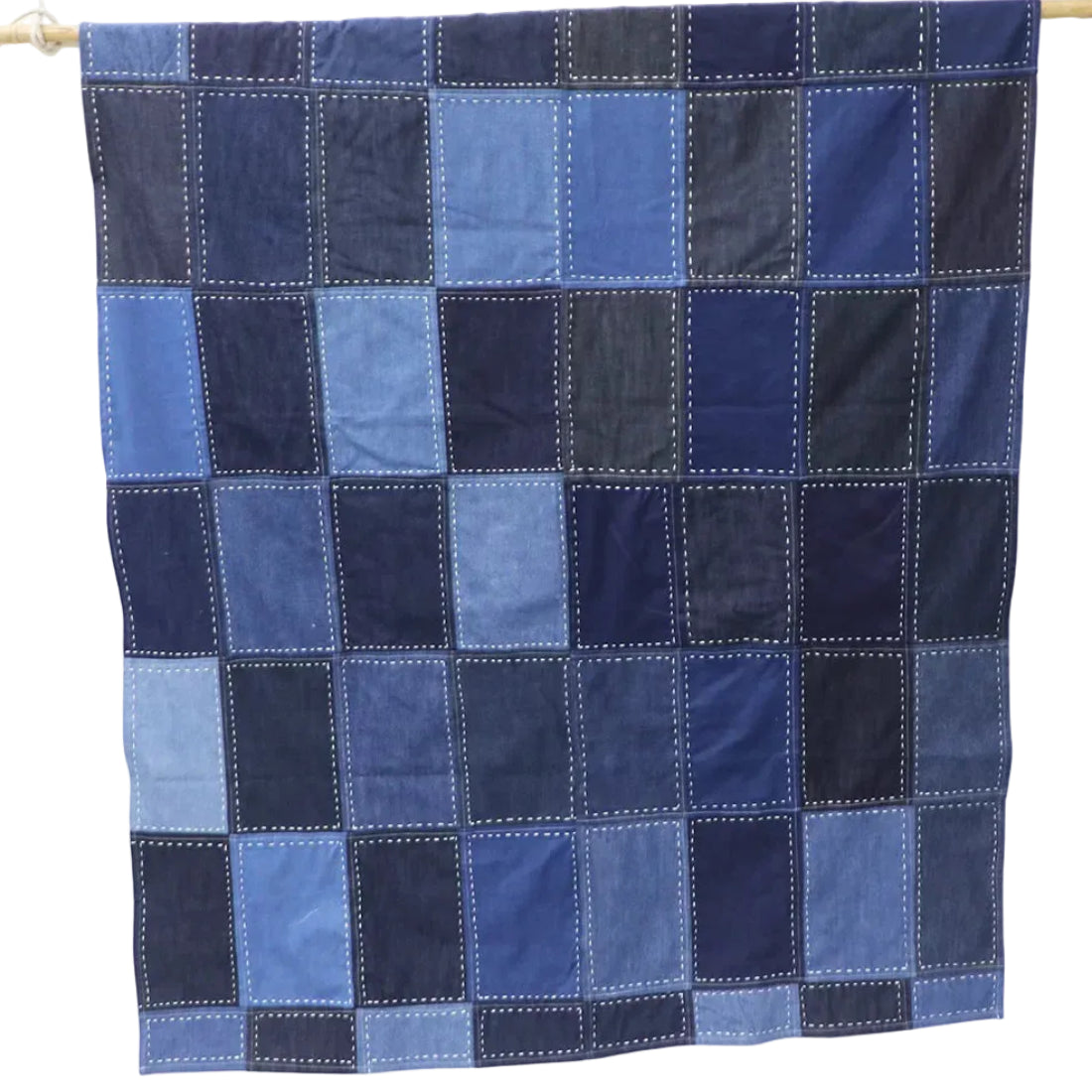 A bold statement of sustainable craft, this Denim Patchwork Throw is a one-of-a-kind creation that transforms leftover denim production cuts into a beautiful, functional work of art. Every patch tells a story of eco-conscious craftsmanship — no two throws are ever exactly alike. Top Layer: Artisan denim patchwork from upcycled production cuts Back Layer: Soft breathable cotton fabric Embroidery: Hand Kantha stitch for added elegance and structure Size: 55 x 80 inches Construction: Thick and durable Versatil