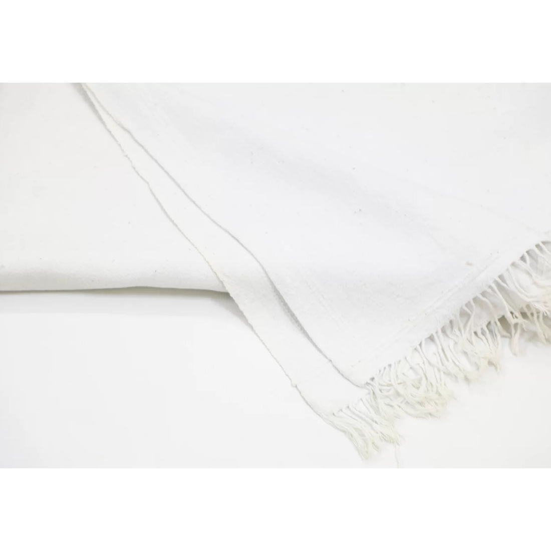 Mid 20th-century handspun white cotton throw from India. Pit-loom woven, 44x84 inches. A soft and timeless heritage textile.