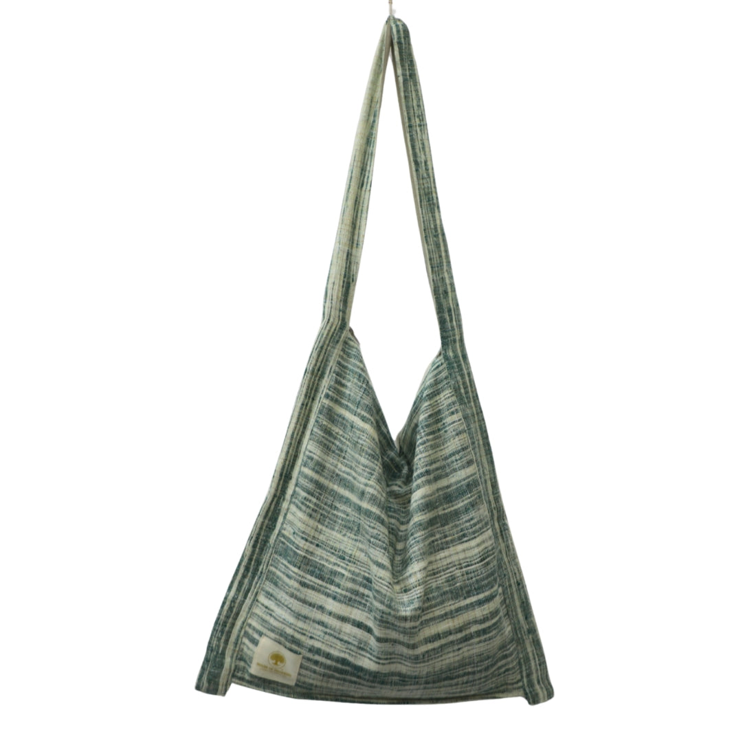 Forest green and white handloom cotton jhola bag. 17×17 inch, zipper top, inner slip pocket, fully lined. Handwoven in India — earthy everyday carry.