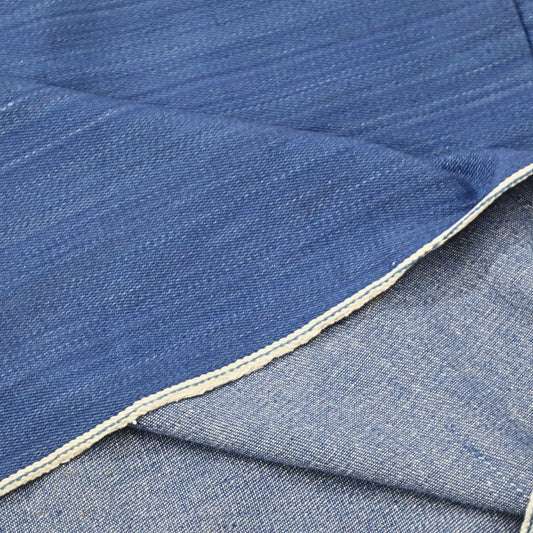 Shop 9 Oz natural indigo handloom denim fabric, plant-dyed with Indigofera tinctoria. Hand-spun, hand-woven by Indian artisans. Global shipping. Sampling available.
